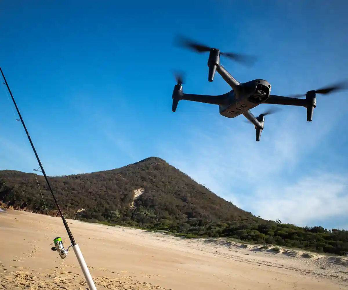 Aeroo Drone flying with fishing rod on beach