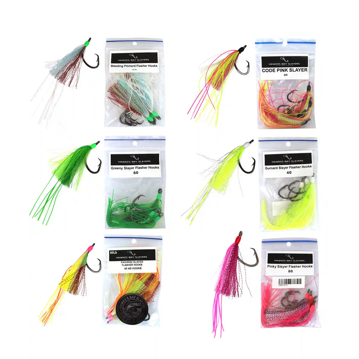 Six packaged fishing lures arranged in a 3-by-2 grid on a white background, each shown with its clear plastic bag and hook. The lures are in bright neon colors including pink, green, yellow, orange, and red, with some featuring glittery or metallic finishes.