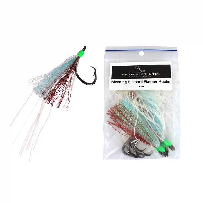 A pack of Hawkes Bay Slayers Bleeding Pilchard Flasher Hooks in a clear plastic bag with a white label, shown next to an individual hook with light blue, red, and white strands on a white background.