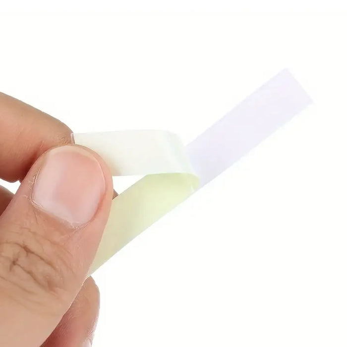 Sea Harvester Luminous Fishing Rod Tape Roll for visibility in the dark held between fingers